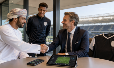 Football representatives agreeing on a sponsorship deal 