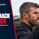 Michael Carrick applauds Old Trafford supporters after Manchester United’s defeat to Bournemouth, alongside the words Fans Back Carrick.